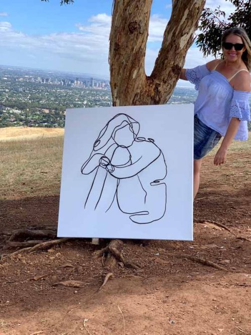 South AUstralian Artist paints woman artwork on brownhill south australia - linear xi